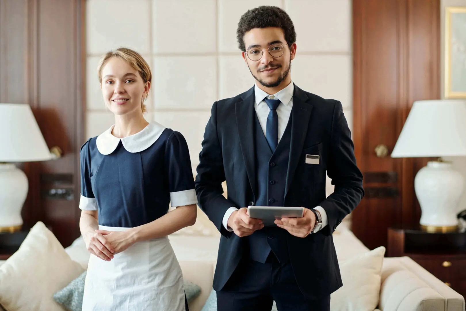 Hotel staff standing in formal attire.
